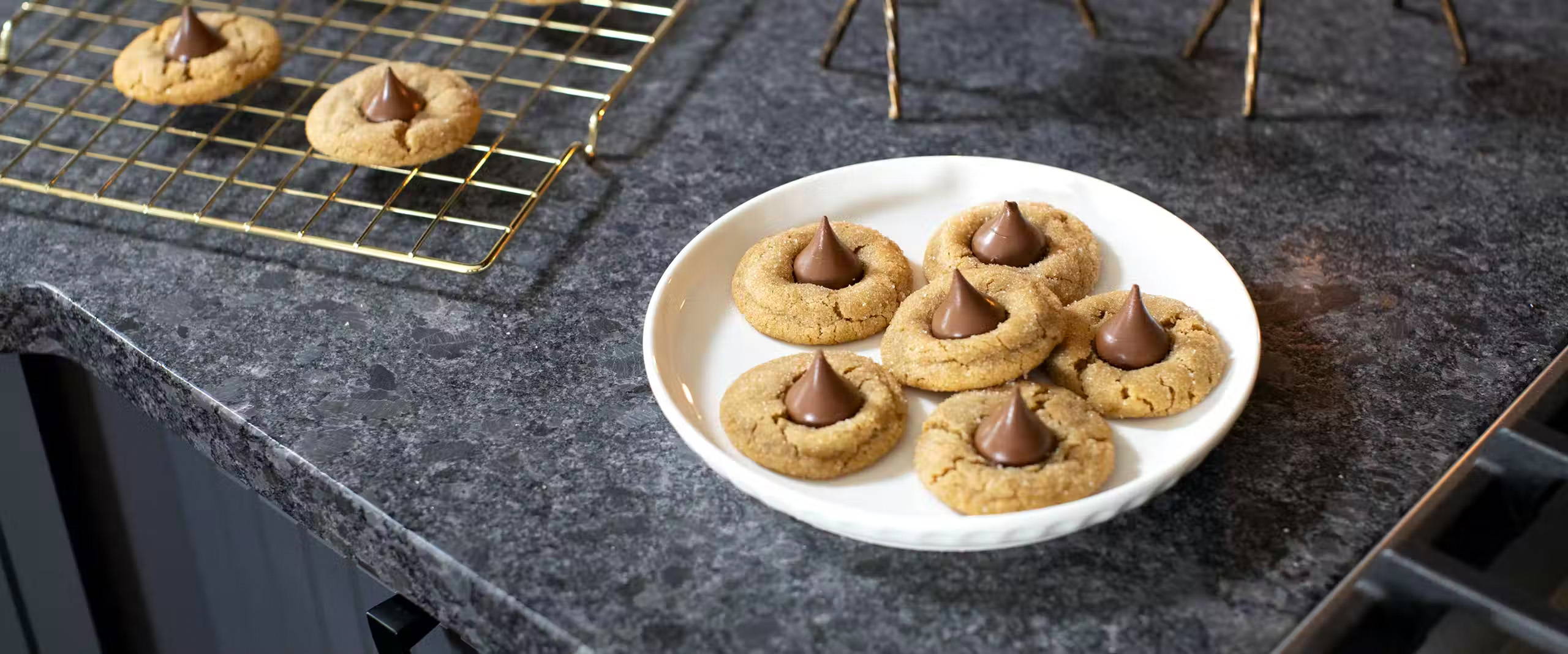 Peanut Butter Blossoms plated on kitchen countertop.