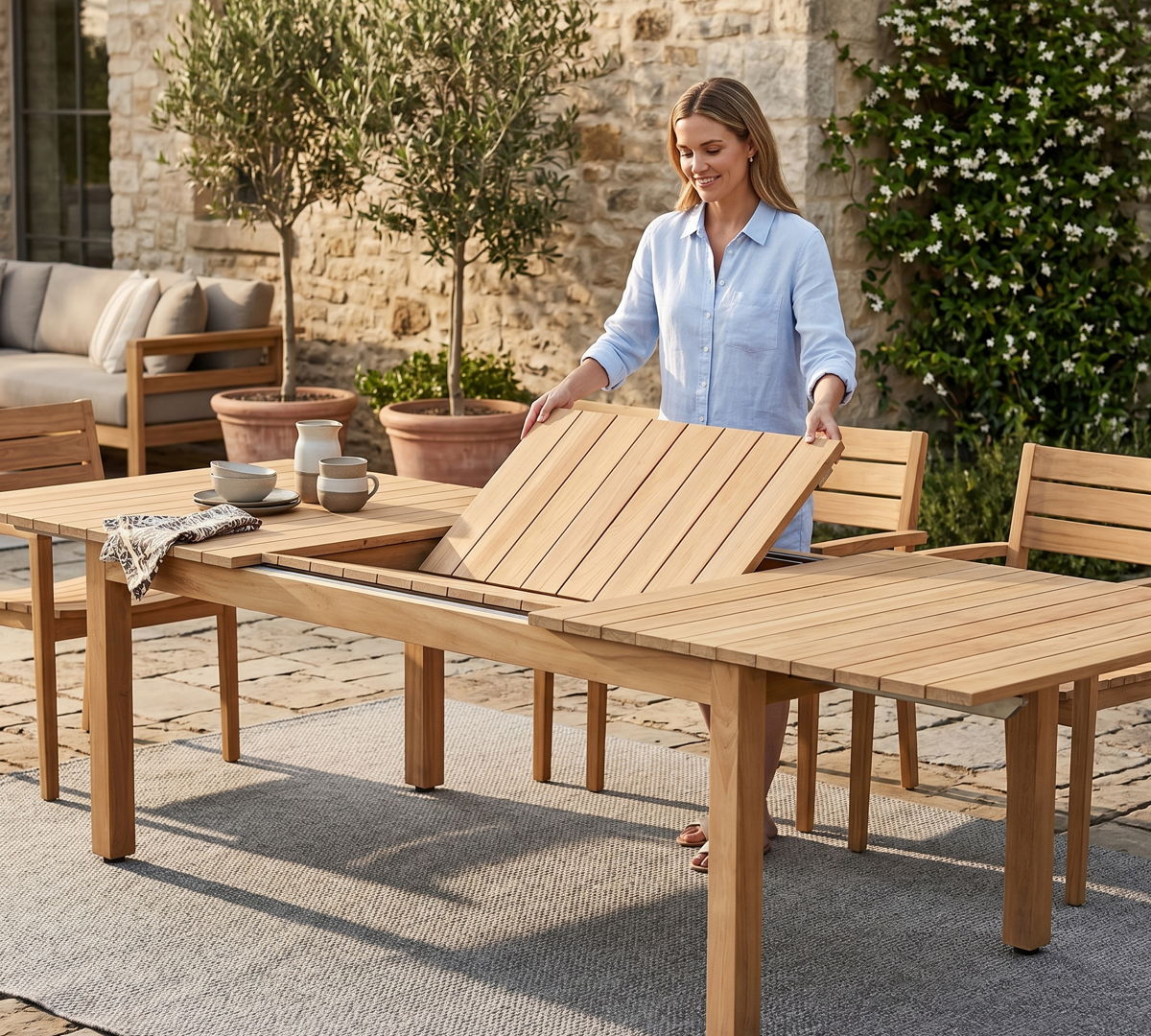 Outdoor dining table with extension leaf, showing flexible outdoor dining furniture for hosting larger backyard gatherings.
