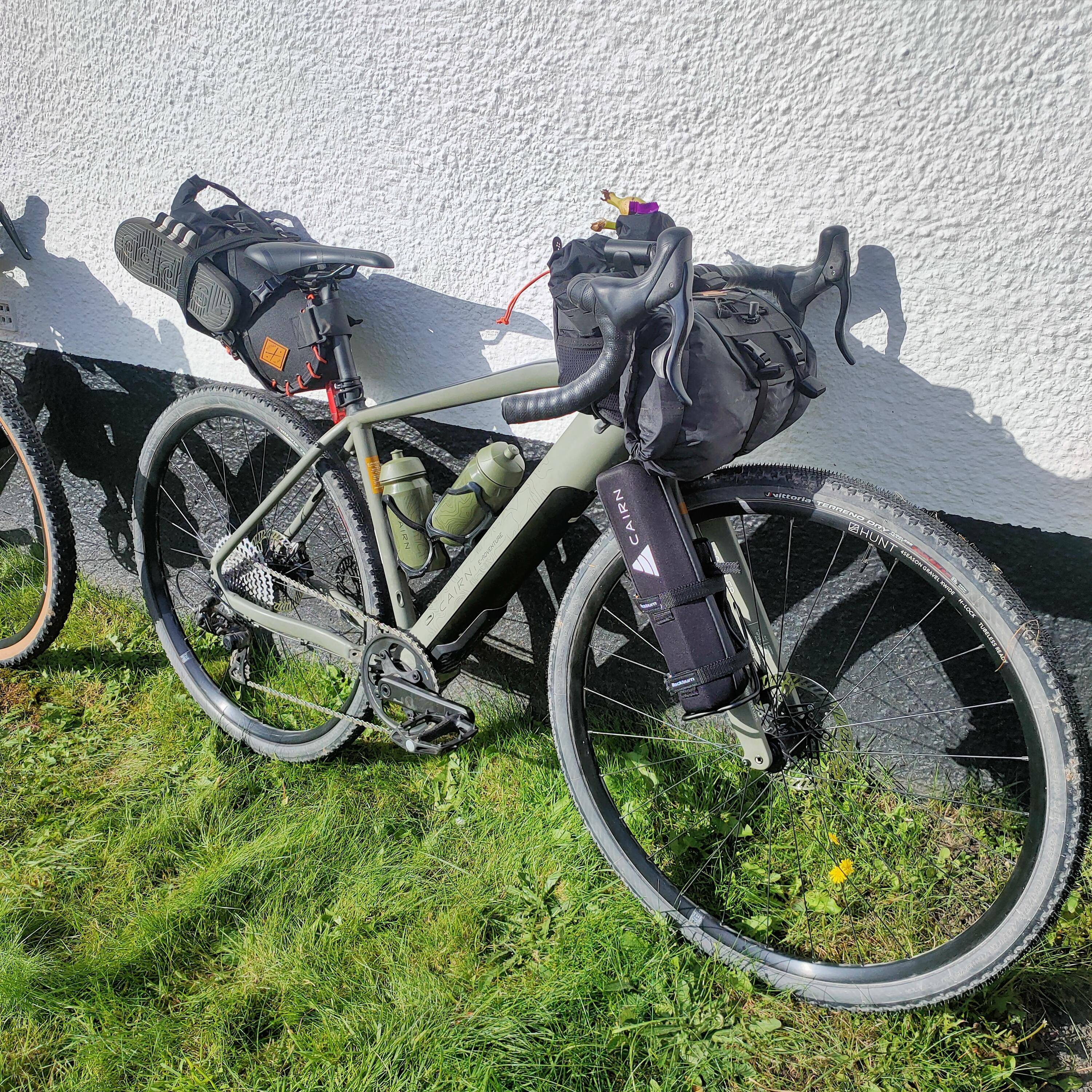 Cairn electric gravel bike fitted with bikepacking bags