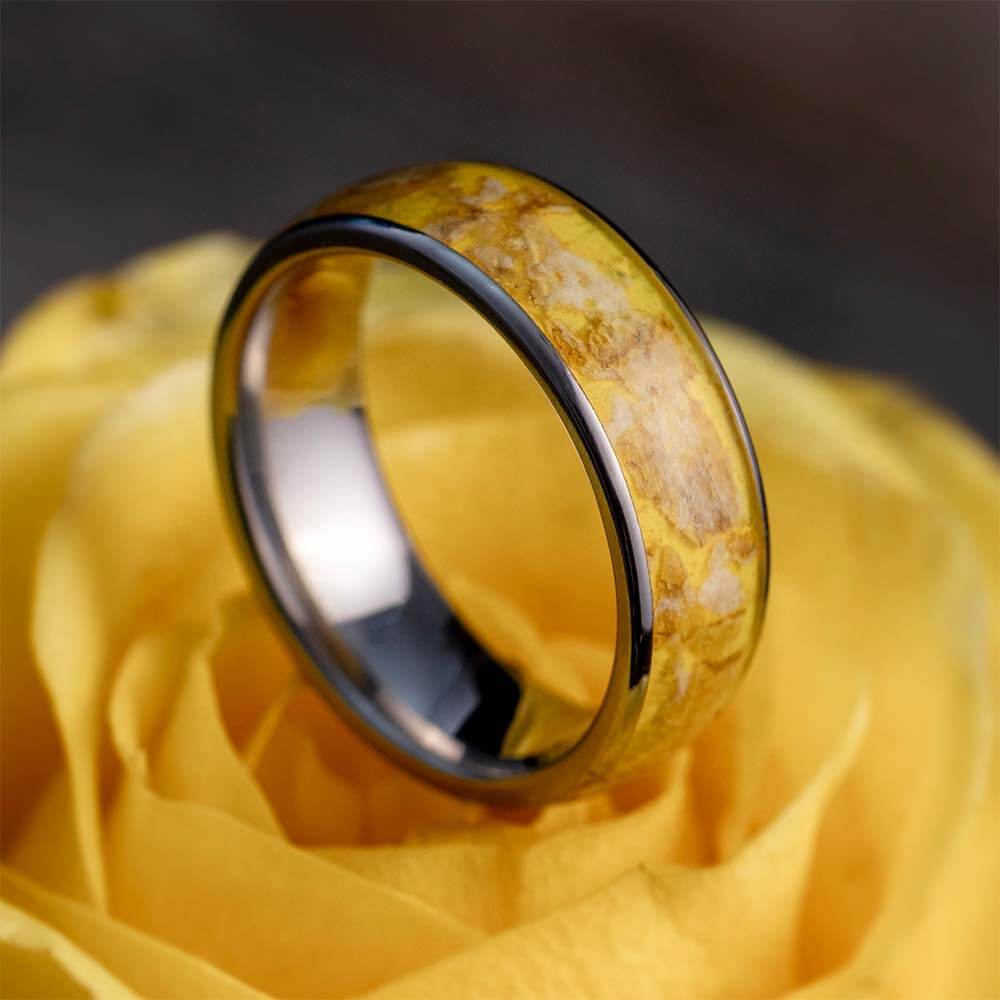 Memorial ring with funeral flower petals inside