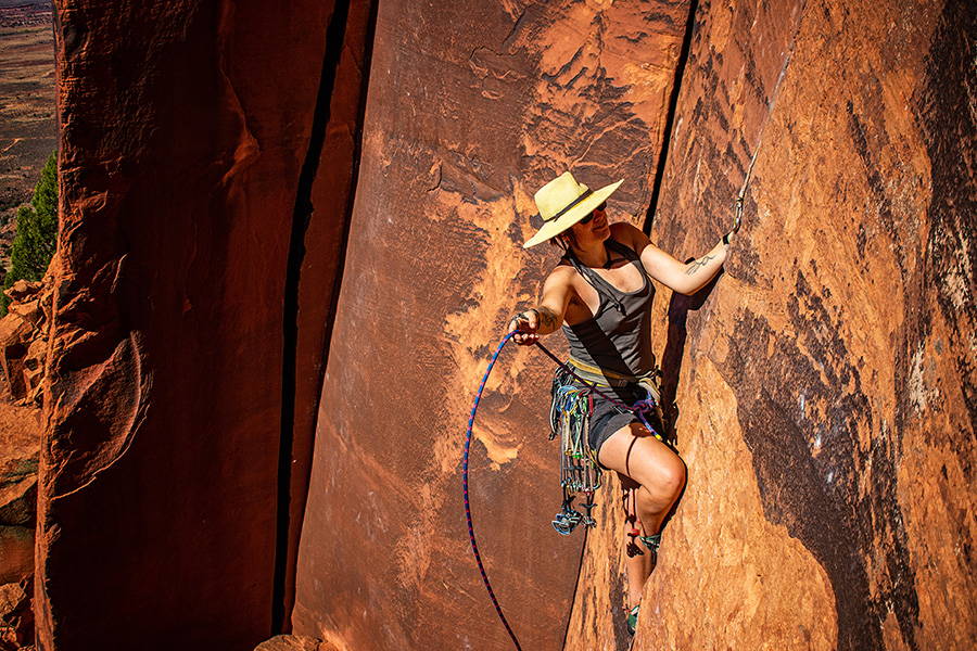 Female climber on red rock