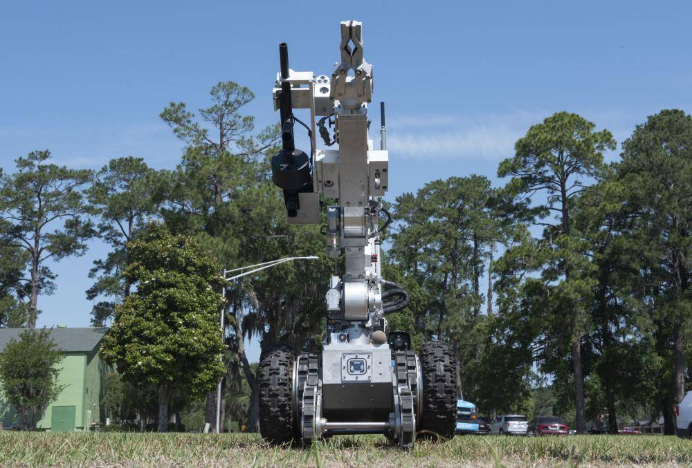 A Remotec Andros F-6B tactical robot stands at attention as part of a law enforcement display during National Police Week at Moody Air Force Base, Georgia May 17, 2022. The F-6B is equipped with a microphone to allow local law enforcement to employ remote negotiations and life-saving tactics during high-stress situations. (U.S. Air Force photo by Staff Sgt. Thomas Johns)