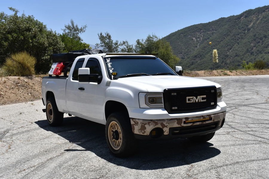 Front three-quarter Jonathan's white 2013 GMC Sierra overland build with bed rack rooftop tent and LED light bar photo 1