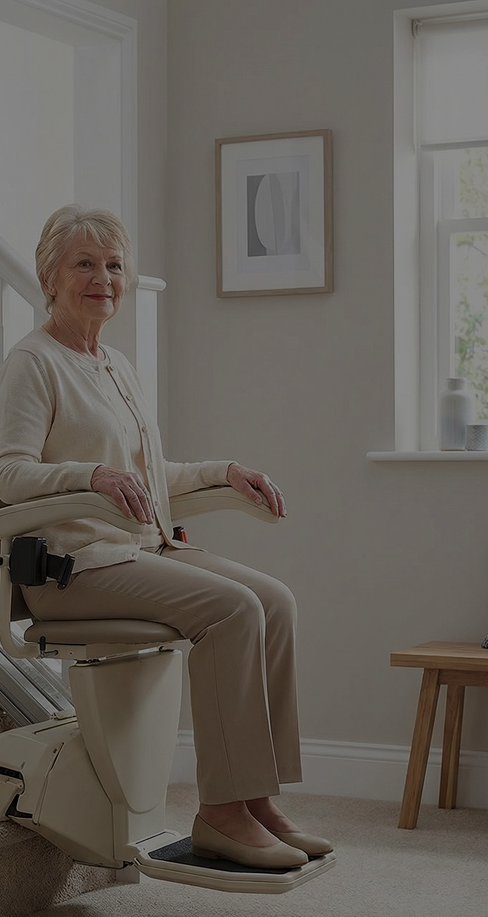 Senior woman riding a stairlift comfortably at home