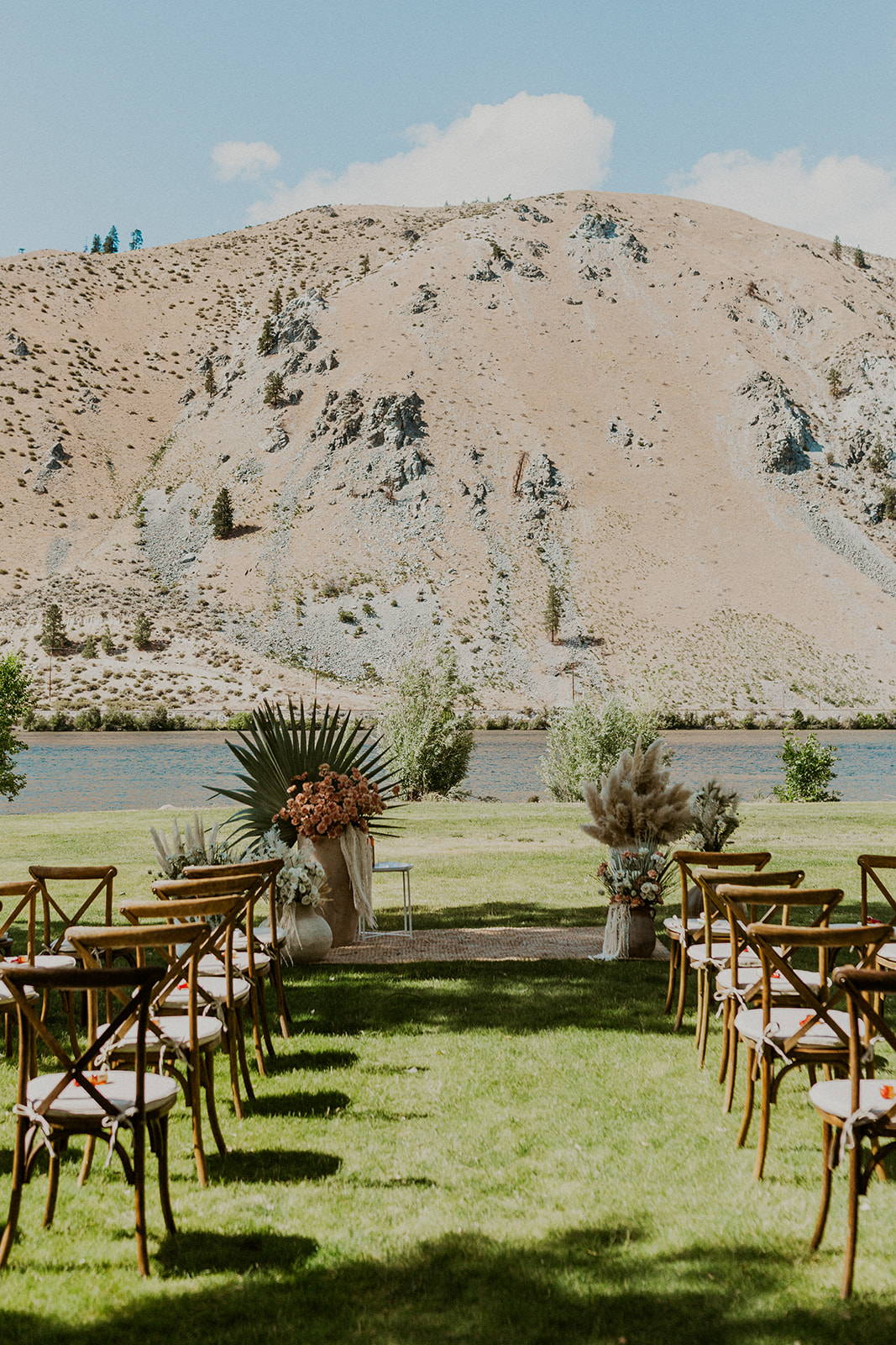 Mountain wedding with leafy green arbor