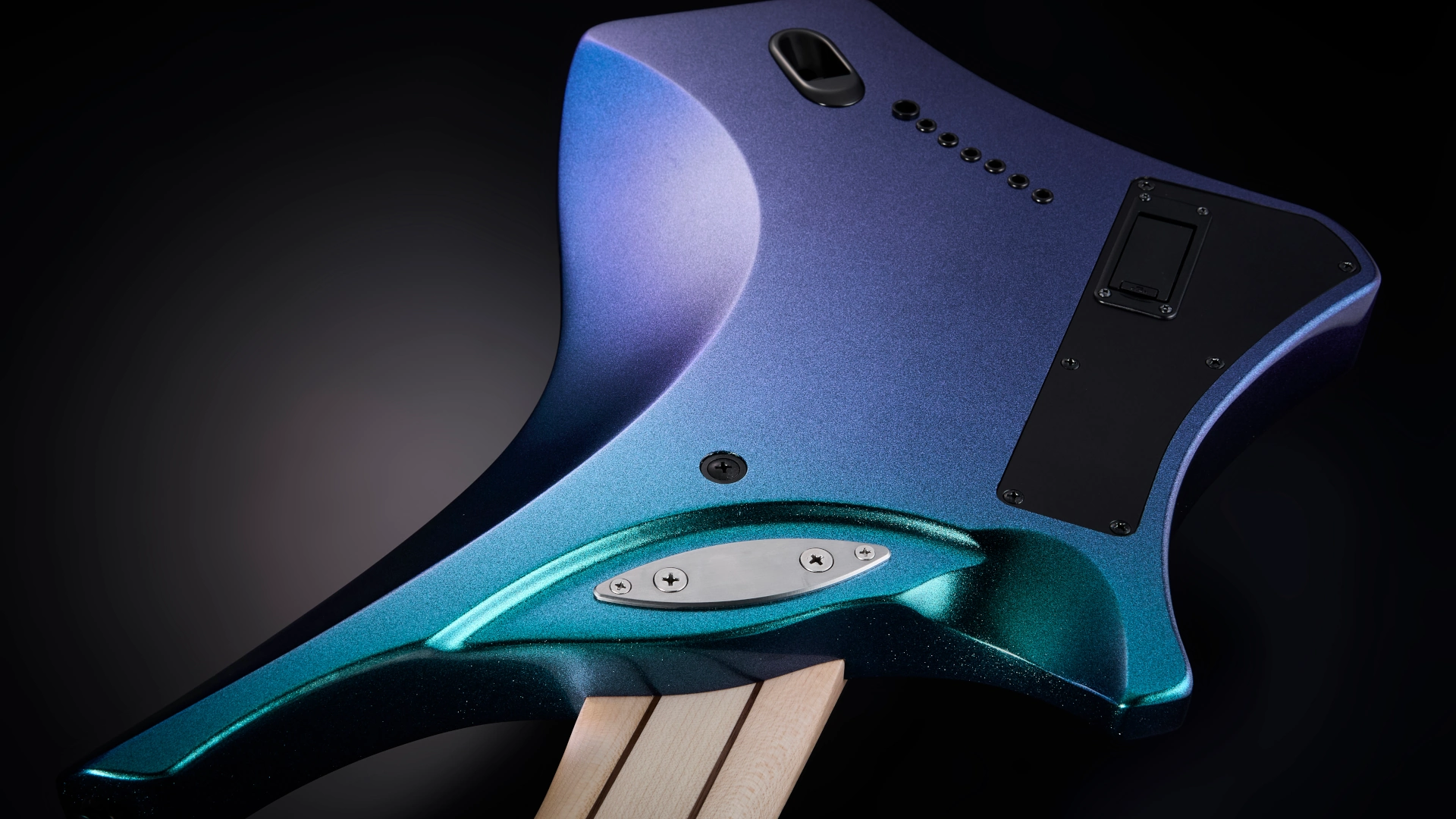 Close-up of the back of an Ibanez Alpha Series electric guitar body from an artistic angle.