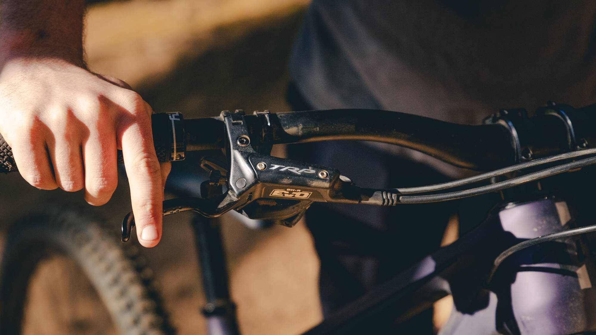 detail of the trp dh-r evo mountain bike brake lever on handlebars
