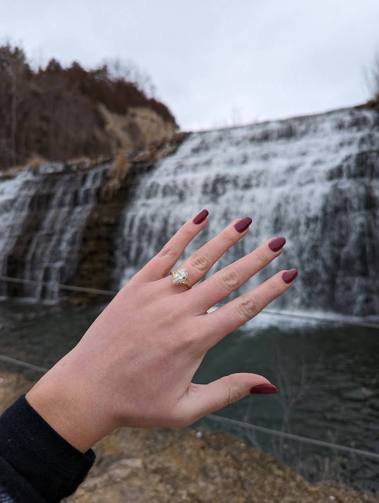 engagement proposal couple in front of waterfall