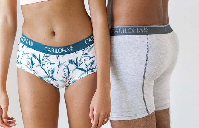 a man wearing gray bamboo boxers and a woman wearing a floral print panties