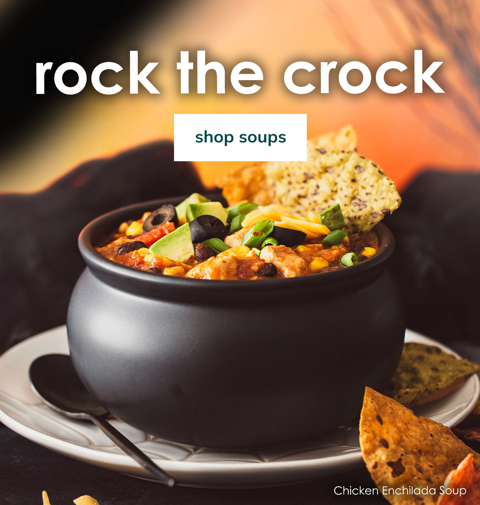 Chicken Enchilada Soup in a black crock with tortilla chips and a “Shop soups” button.