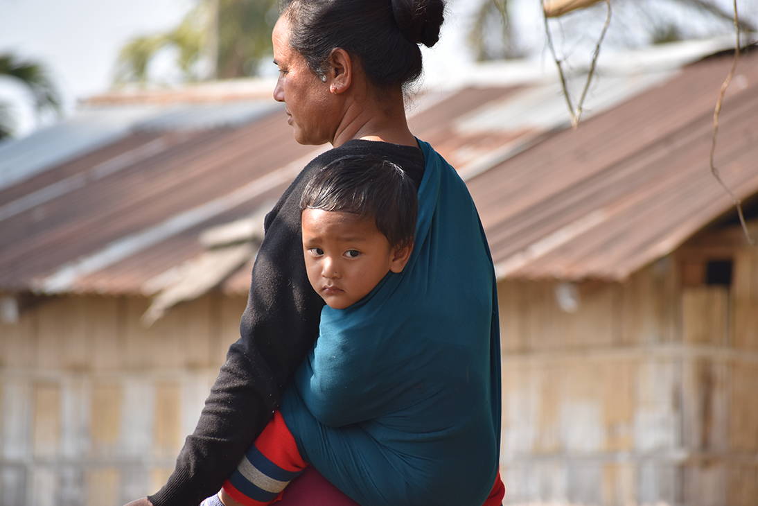 Khasi mother with traditional baby sling