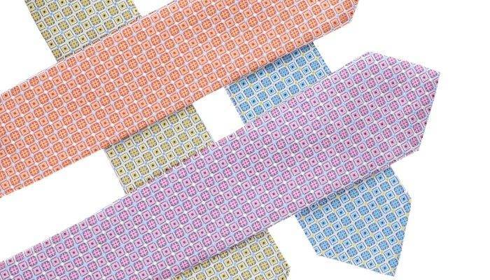 Display of colorful neckties with hashtag design