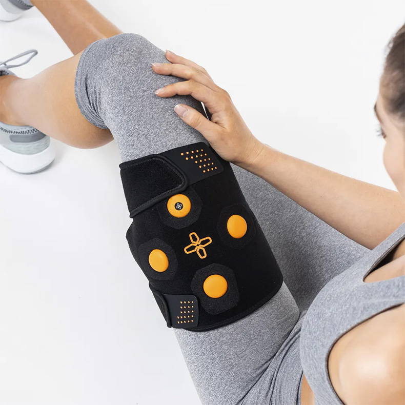 Myovolt wearable vibration therapy device wraps around the thigh to treat muscle pain and stiffness in quads and hamstrings. Great for athlete recovery to rejuvenate tired leg muscles after exercise.