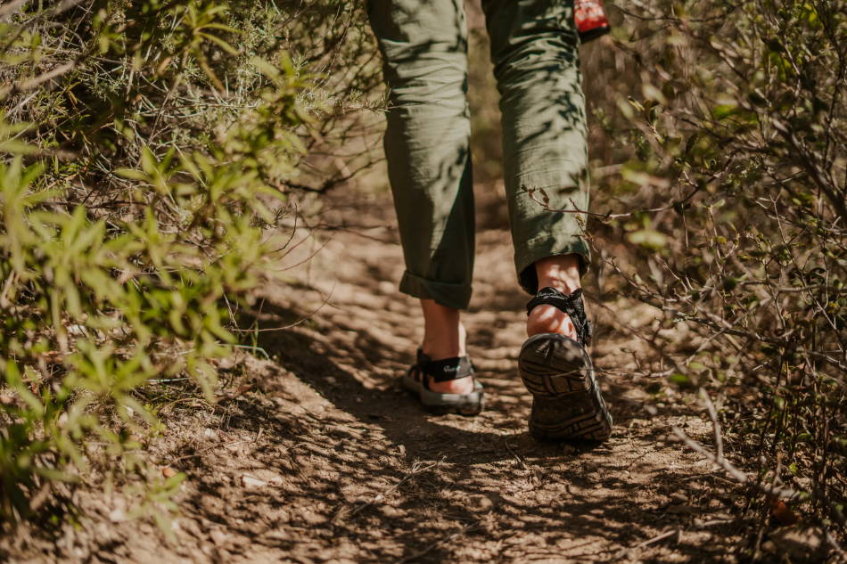 women hiking on a trail in outdoor sandals