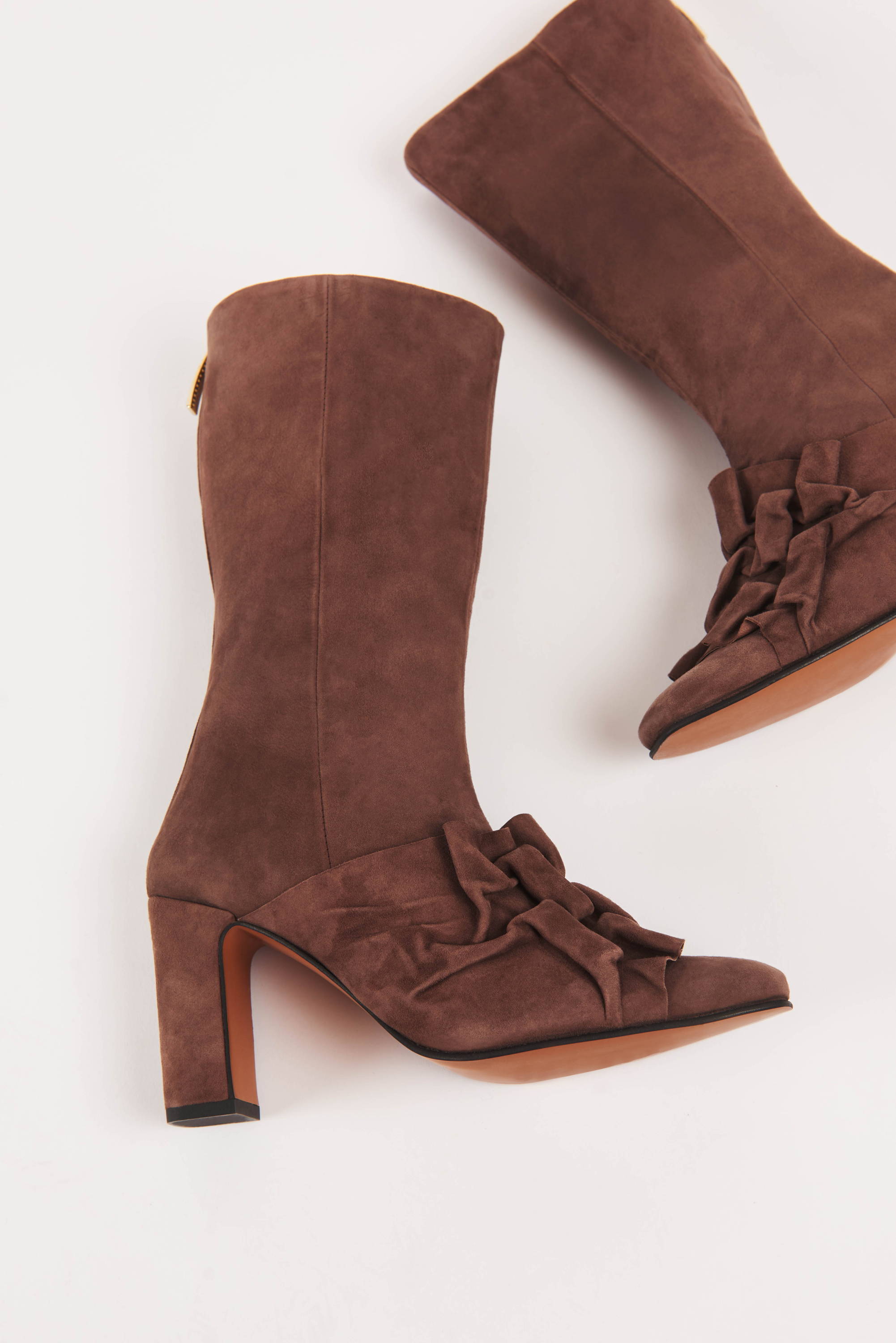 Pair of Vandrelaar brown suede Greta ankle high-heel boot with canadian smocking detail and brown sole