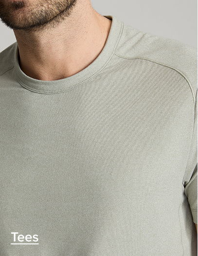 Close-up of a man wearing a light green t-shirt.
