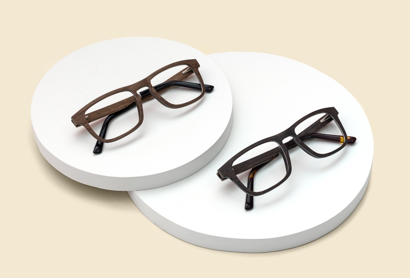 flat lay image of Kraywoods migraine glasses on a tan background