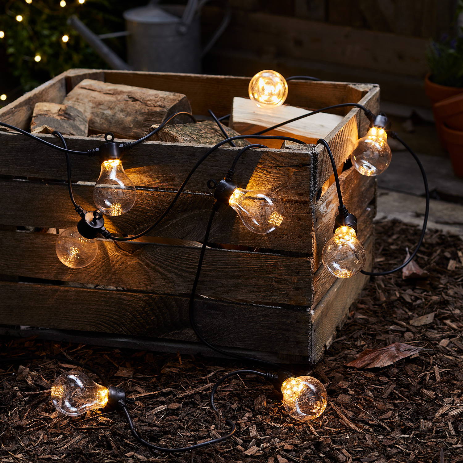 Core connect festoons draped over wooden crate outdoors