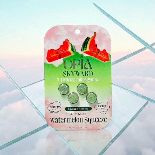 Watermelon-flavored product packaging on a reflective surface.