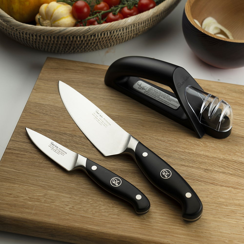 Professional Kitchen Knife Set with Sharpener on a wooden cutting board.
