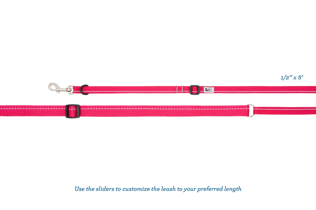 Pink adjustable dog leash with slide mechanism for length customization.