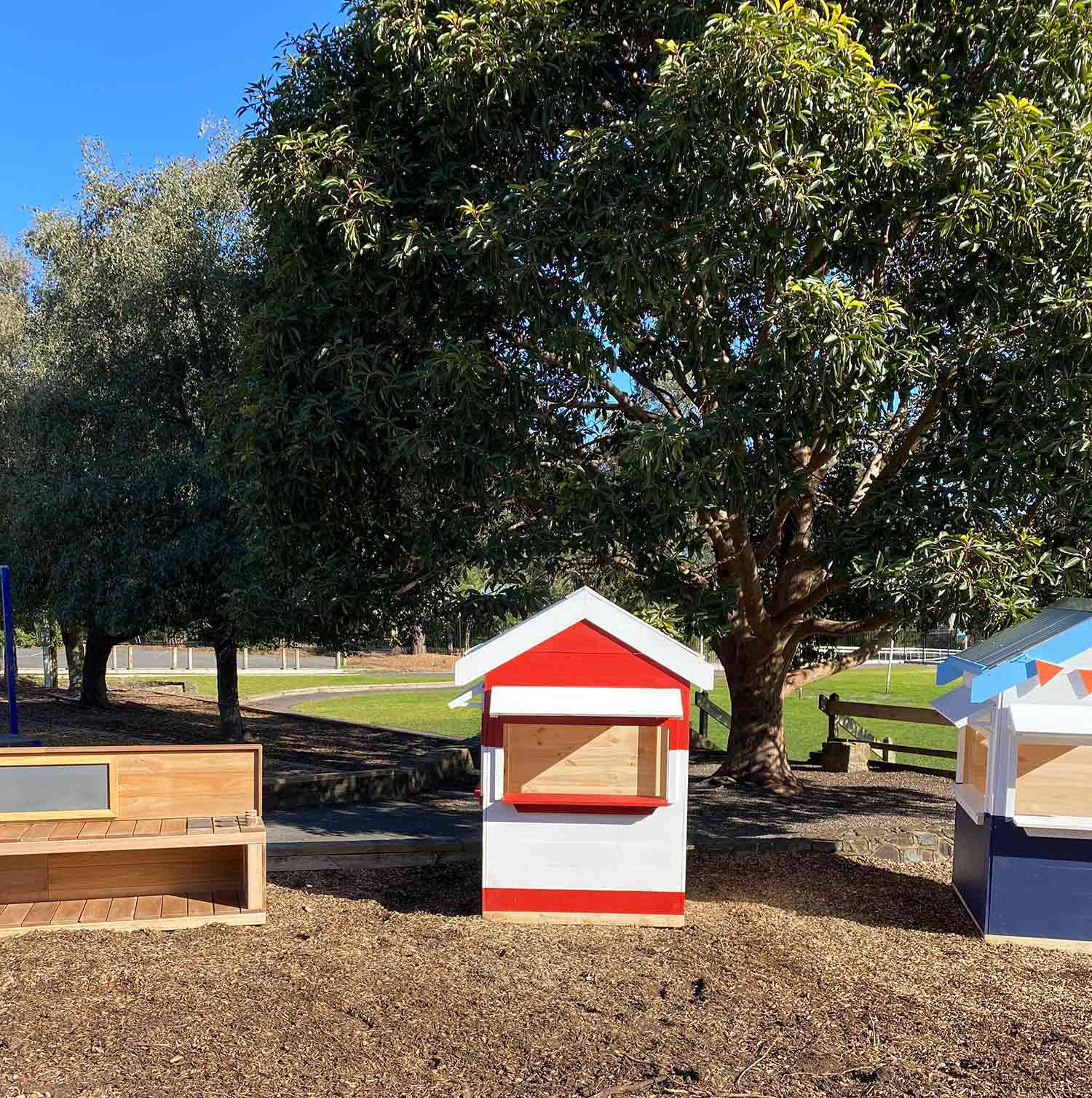 Sun shines on the new wooden cubby house village for Belgrave South Primary School