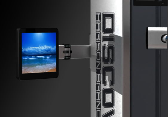A tablet displaying a beach scene attached to a device.