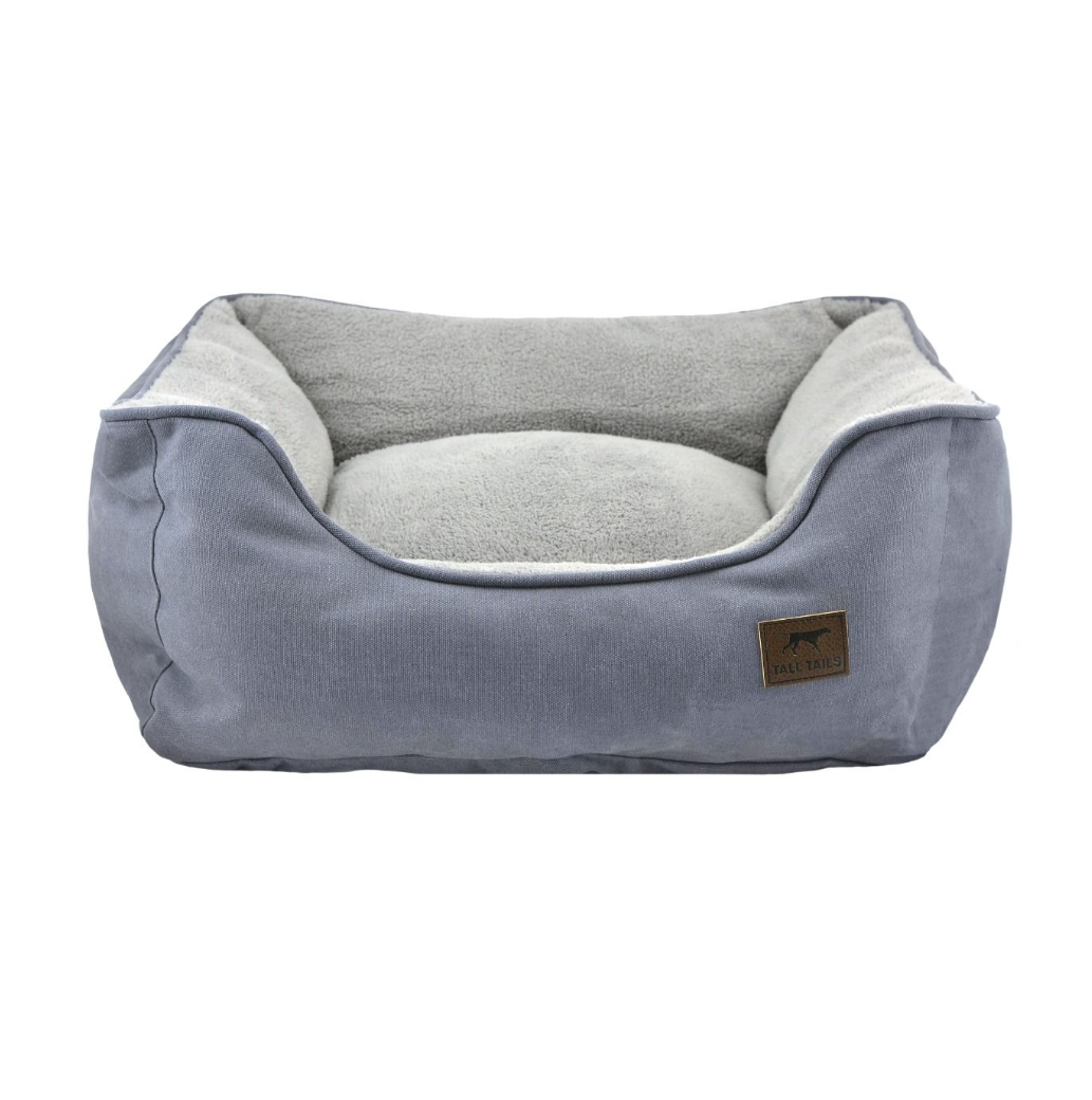 a grey and blue bolster bed for pets