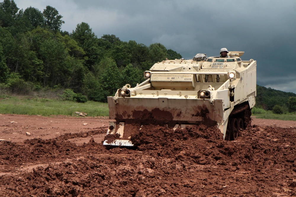 Sgt. Ricardo Lindsay, horizontal construction engineer with 252nd Quarter Master Company, 728th Combat Sustainment Support Battalion, 213th Regional Support Group, Pennsylvania Army National Guard, operates an M9 armored combat earthmover during annual training at Fort Indiantown Gap June 7, 2017.