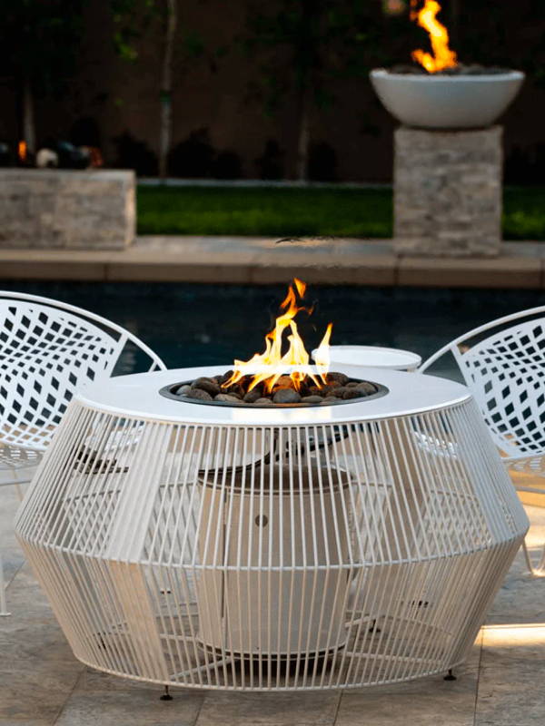 Boxhill's Cesto Metal Powder Coated Fire Pit Table surrounded by geometric chairs.