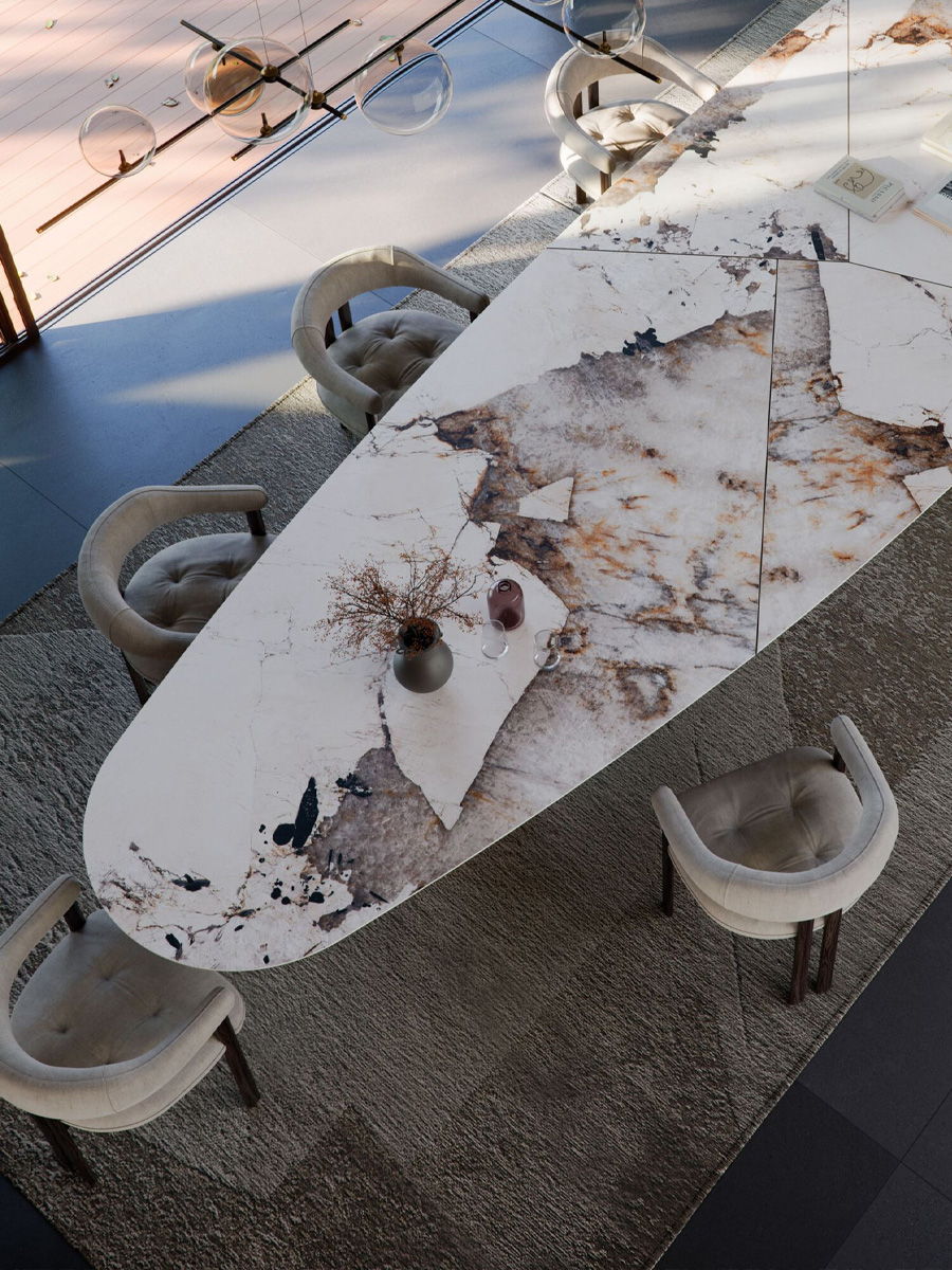 Modern Cattelan Italia dining table with unique marble design and surrounding chairs.