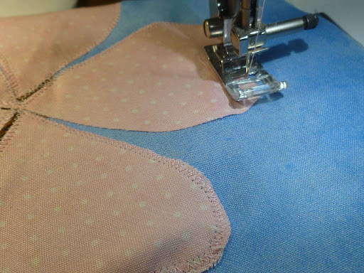 Stitching petal shapes onto quilt background fabric