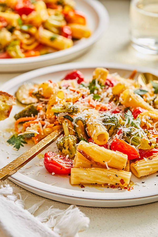 Tortiglioni pasta with tomatoes, broccoli, squash, zucchini and carrots in a light sauce.