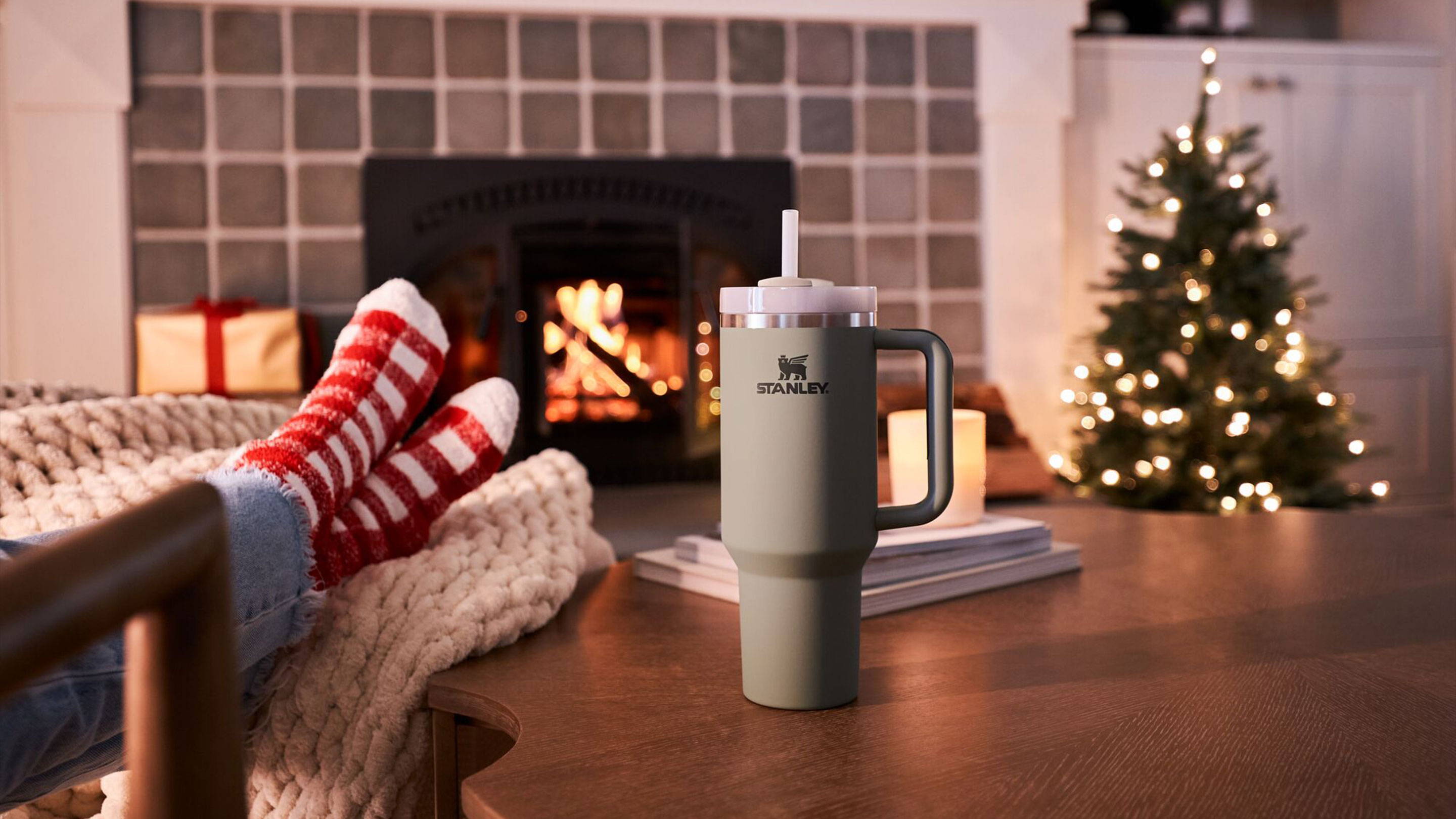 Stanley Tumbler Cup On Coffee Table In Front Of Fireplace