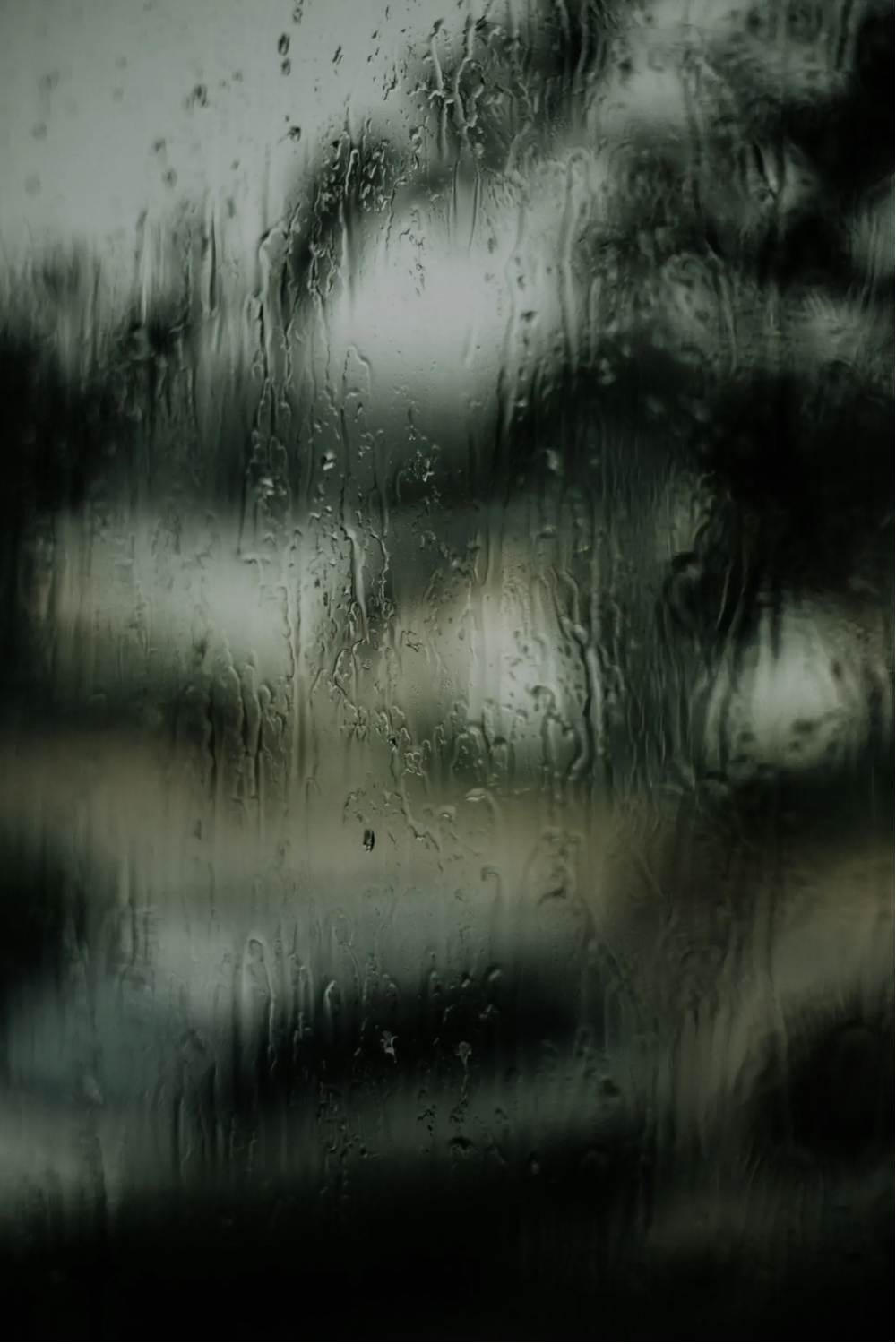 Raindrops running down a window