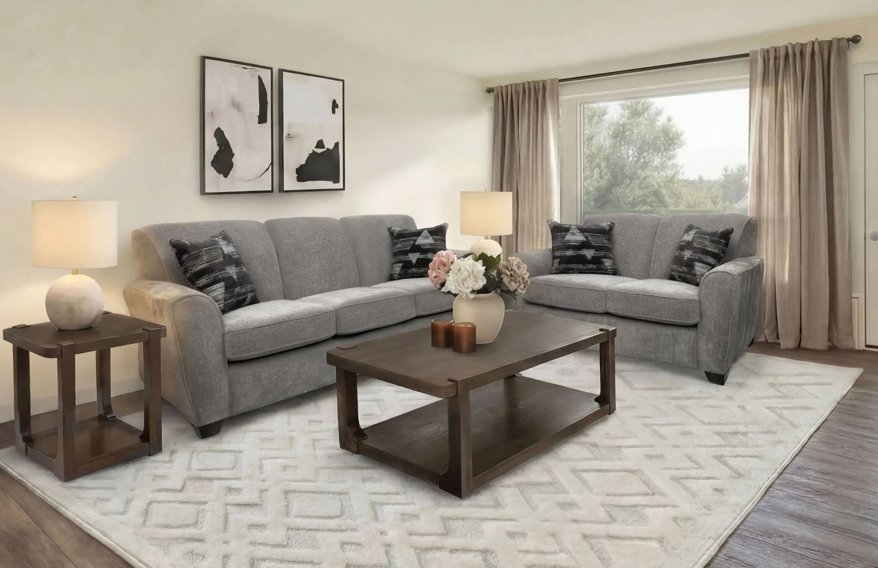 Modern living room with gray sofas, coffee table, and decorative elements.