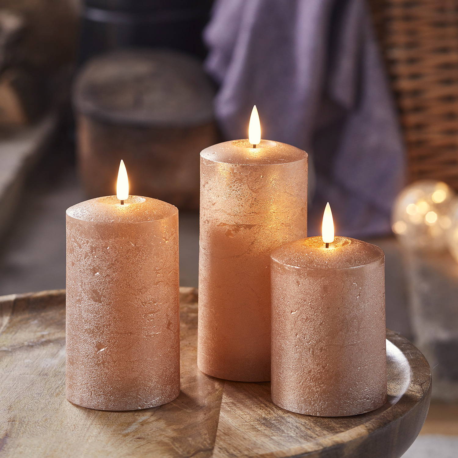 Distressed copper autumn candles in a cosy room
