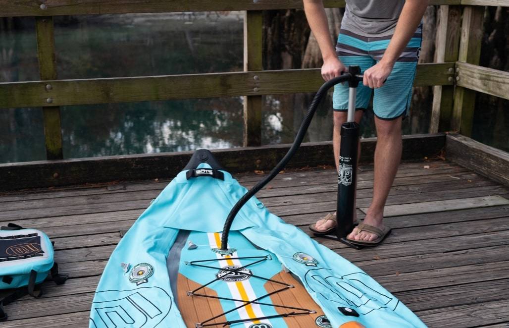 Man inflating kayak