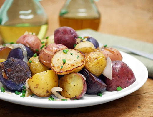 Roasted Gemstone® Potatoes with Caramelized Shallots and Cipolline Onions