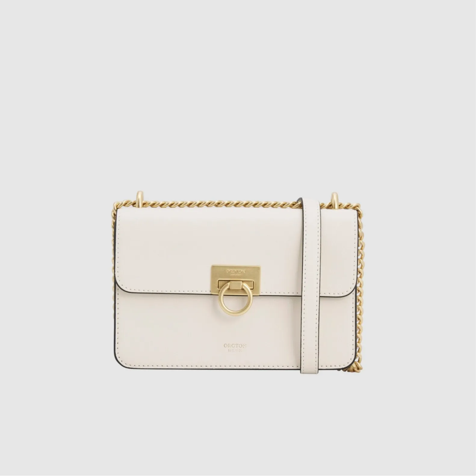 White handbag with gold hardware and a chain strap.