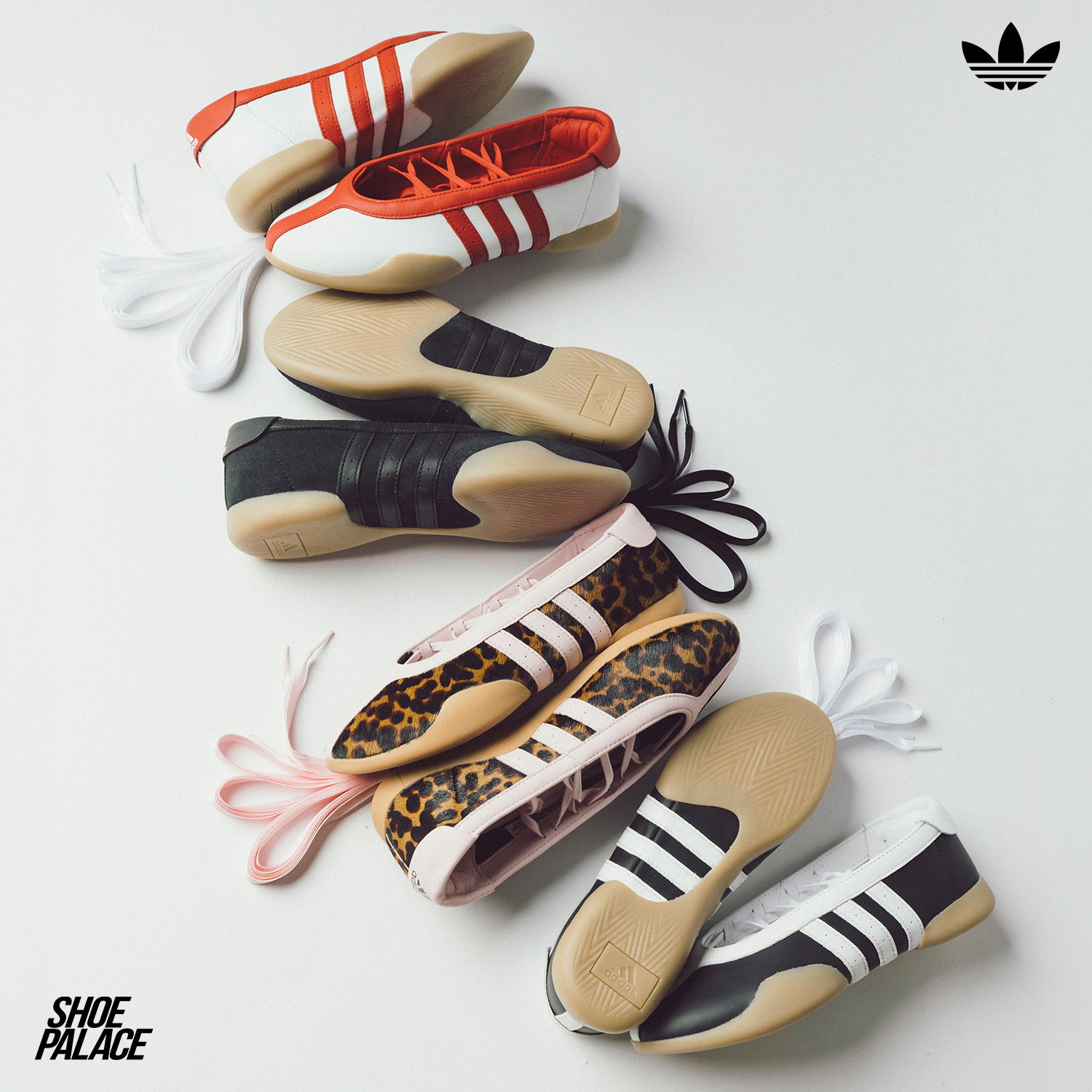 Various styles of Adidas shoes arranged on a white background.