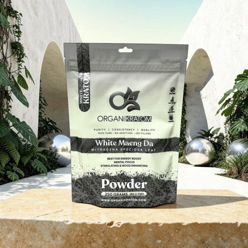 Organic White Moringa Powder packaging in a modern outdoor setting.