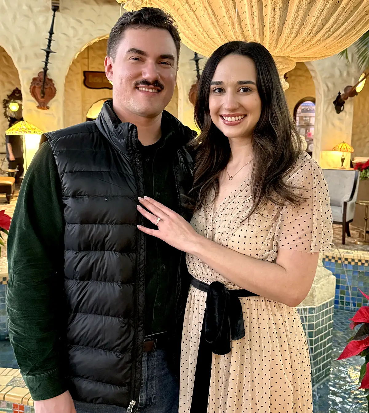 Henne Couple smiling - wearing diamond engagement ring