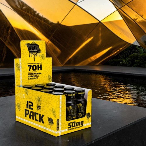 A display of a yellow 12-pack product near a reflective surface.