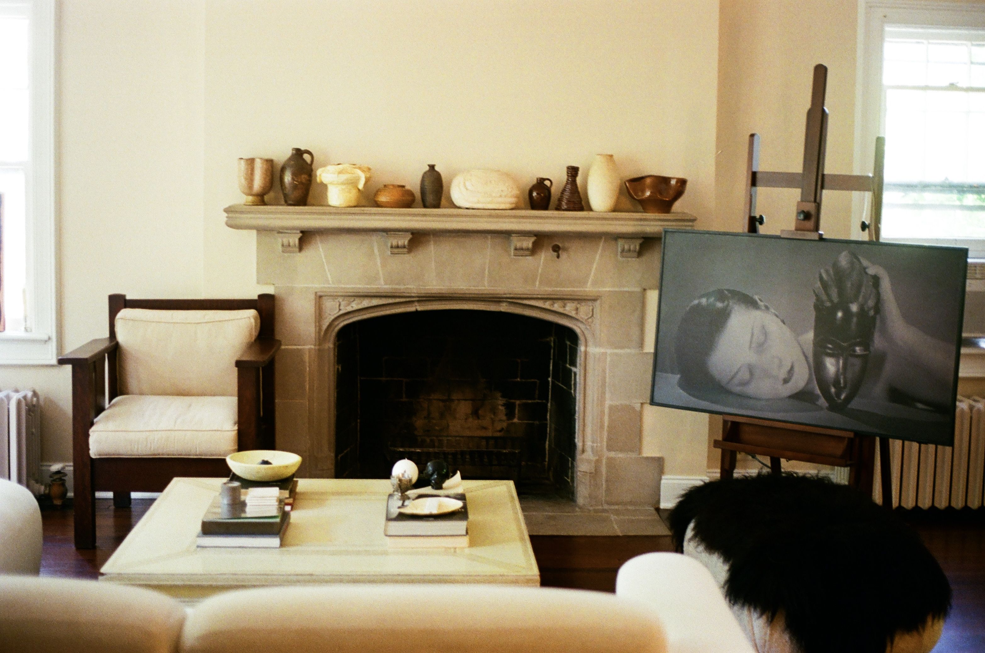 Living room with a fireplace, TV, and cozy seating.