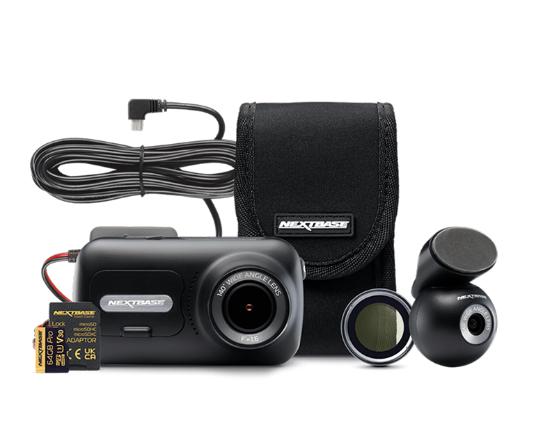 A camera with accessories including a charger and storage card.