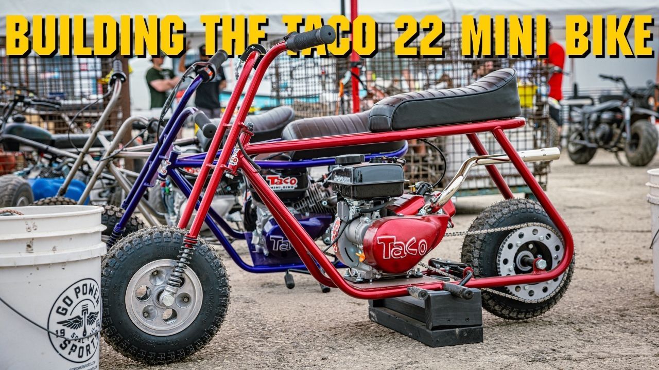 A red and blue mini bike in a workshop setting.