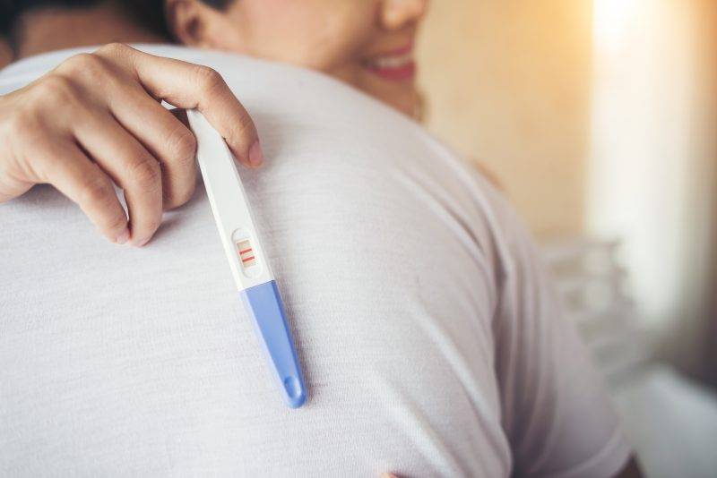 Women Holding Pregnancy Test