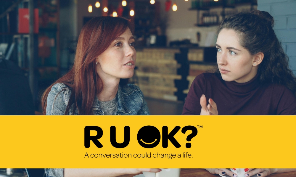 Two women talking in a café with 
