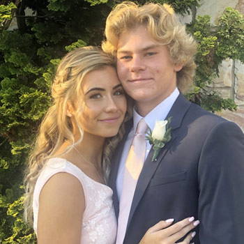 A wedding picture of a couple with a matching tie and dress